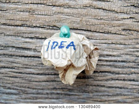 concept creased paper of idea on wooden