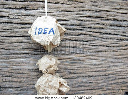 concept creased paper of idea on wooden
