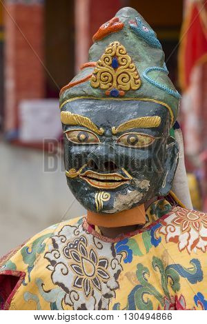 LAMAYURU INDIA - JUNE 13 2015: An unidentified buddhist lamas dressed in mystical mask dancing Tsam mystery dance in time of Yuru Kabgyat Buddhist festival at Lamayuru Gompa Ladakh North India