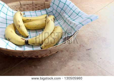 Cavendish Banana in the bamboo basket on table
