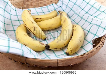 Cavendish Banana in the bamboo basket on table