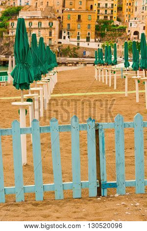 Beach Umbrellas on the Background of the Italian City of Minori