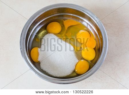 Eggs And Sugar In Mixing Bowl