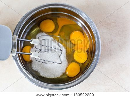 Eggs And Sugar In Mixing Bowl