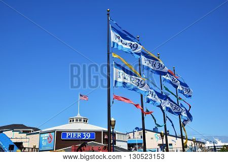 SAN FRANCISCO, USA - MAY 08, 2016: San Francisco Destination Pier 39 Sign and flags, United States Flag