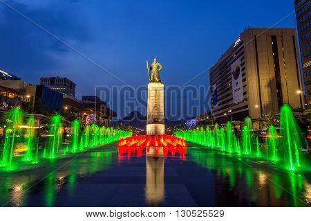 SEOUL SOUTH KOREA - APRIL 30 2016:Beautifully color water fountain at Gwanghwamun Plaza with the statue of the Admiral Yi Sun-sin in downtown.Photo taken on April 302016 in seoulSouth Korea.