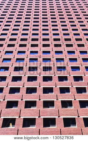 Perspective shot of red  brick building with windows