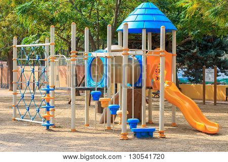 Сhildren playground multi unit with swings, agility equipment, slide and challenge net