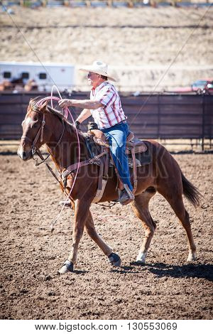 Wickenburg, USA - February 5, 2013: Riders compete in a team roping competition in Wickenburg, Arizona, USA