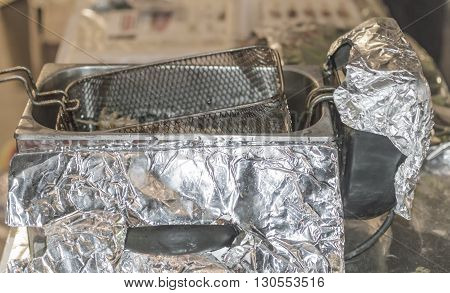Steel fryer for chips and other fast food.
