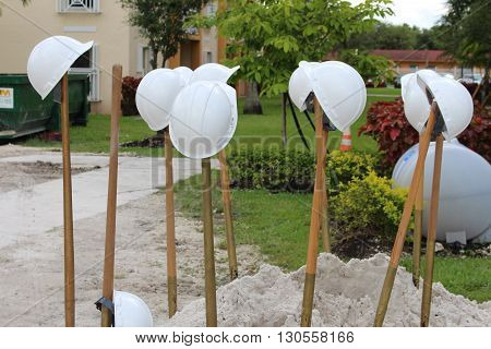 a picture of a groundbreaking and hats