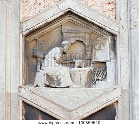 FLORENCE, ITALY - JUNE 05: Tubalcain by Nino Pisano, 1334-36., Relief on Giotto Campanile of Cattedrale di Santa Maria del Fiore (Cathedral of Saint Mary of the Flower), Florence on June 05, 2015