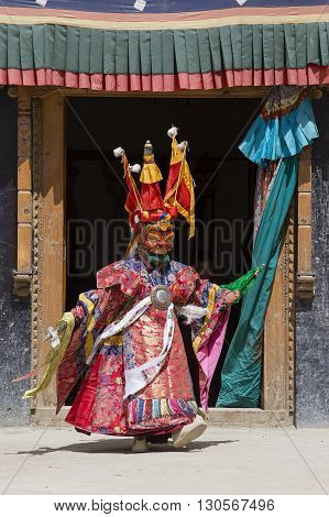 LAMAYURU INDIA - JUNE 13 2015: An unidentified buddhist lamas dressed in mystical mask dancing Tsam mystery dance in time of Yuru Kabgyat Buddhist festival at Lamayuru Gompa Ladakh North India