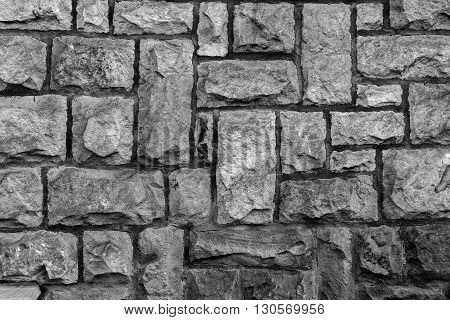 weathered stone cladded wall for background or texture