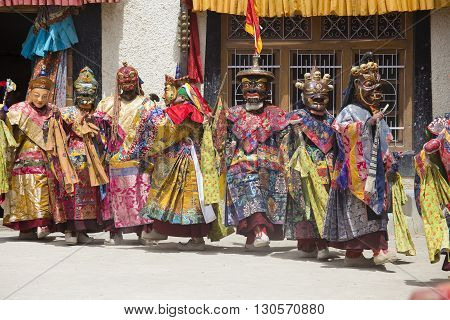 LAMAYURU INDIA - JUNE 13 2015: An unidentified buddhist lamas dressed in mystical mask dancing Tsam mystery dance in time of Yuru Kabgyat Buddhist festival at Lamayuru Gompa Ladakh North India