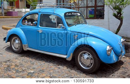 PUERTO VALLARTA MEXICO MAY 11 2016: Volkswagen Beetle or Bug is a two-door, four passenger, rear-engine economy car manufactured and marketed by German automaker Volkswagen (VW) from 1938 until 2003.