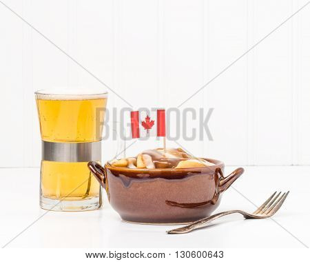 Bowl of poutine a uniquely Canadian dish originating from the Province of Quebec.