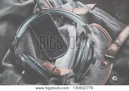 Music On The Road Trip, Phone And Headphones On A Backpack