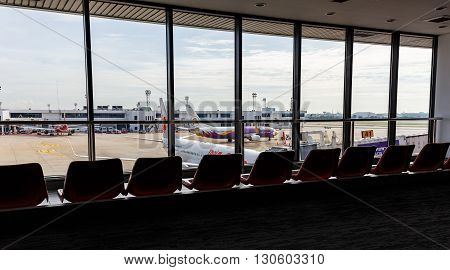 BANGKOK THAILAND - 12 SEPTEMBER 2015 - Airplanes connected to jetway at Don Muang international airport.