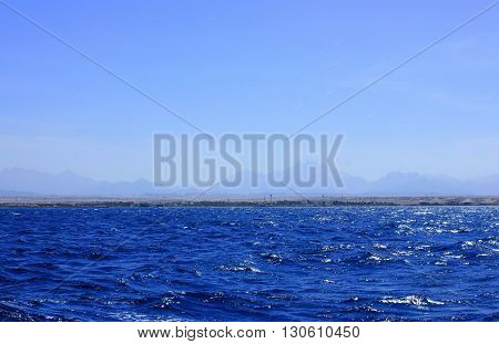 Sea Blue Water Background at Sun Light.