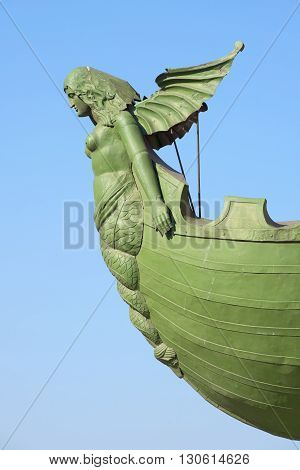 SAINT PETERSBURG, RUSSIA - MARCH 28, 2016: Rostra with Naiad in profile closeup. A fragment of the North the Rostral columns. The landmark of  Saint-Petersburg, Russia