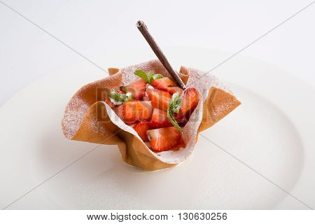 Fresh bright strawberry dessert with cream and chocolate