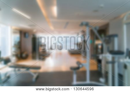 Abstract blur Fitness center with traineger equipments