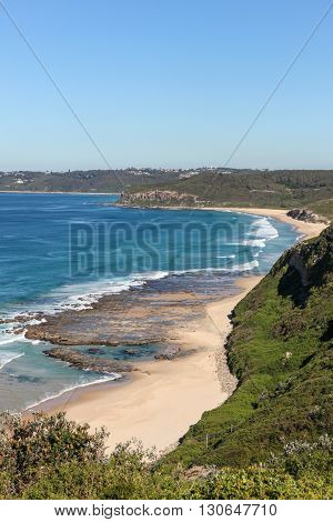Burwood Beach viewed from above on a nice autumn day. Newcastle is a popular travel destination and home to many beaches such as this only a short distance from the CBD.