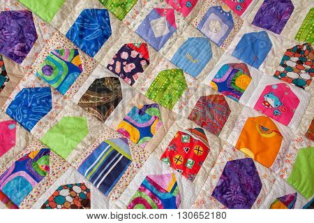 Patchwork quilt. Part of patchwork quilt as background. A blanket in style patchwork. Color blanket. Handmade. House print.