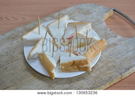 sandwich pork bologna cocktail on white dish