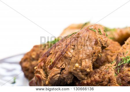 Delicious eastern baked meat mix with garnish. Served with chicken eggs and fresh vegetables. Macro. Photo can be used as a whole background.