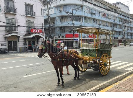 Manila Philippines - July 19 2015 : A Kalesa (or Horse Carriage) in Historic Town of Intramuros Intramuros is the oldest district and historic core of Manila Philippines