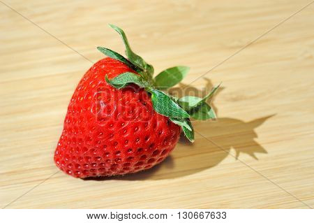 macro strawberry on wooden background of table