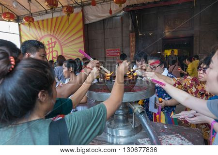 Thai People Pray In Chinese Temple