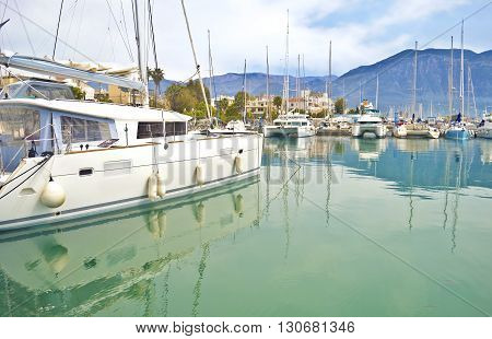 boats reflected on sea at Kalamata harbor Peloponnese Greece