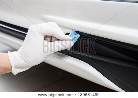Car detailing series : Closeup of hand coating plastic part