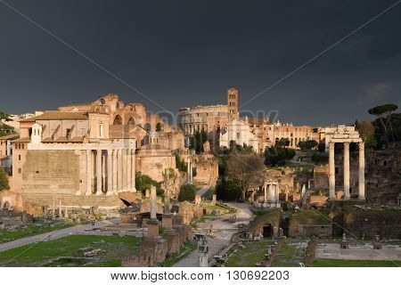 Dramatic sky over the Forum Romanum in the evening light Rome Italy