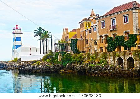 A small bay of the Atlantic. A medieval castle on the shore.