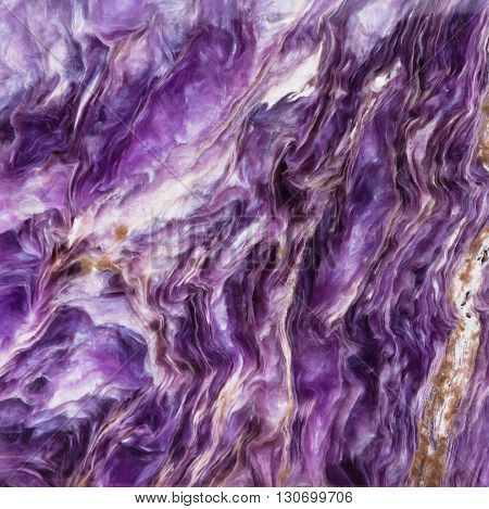 macro shooting of natural mineral stone - square background from polished charoite gemstone