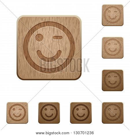 Set of carved wooden winking emoticon buttons in 8 variations.