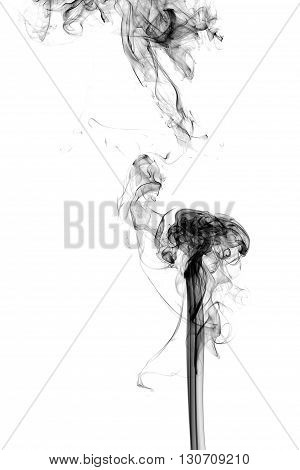 White smoke on black background from the incense sticks