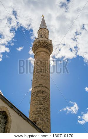 Minaret In Turkey Convering The Sun