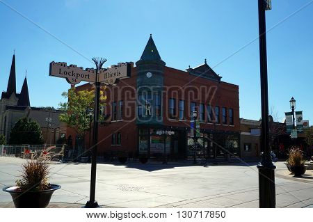 PLAINFIELD, ILLINOIS / UNITED STATES - SEPTEMBER 20, 2015: Street signs mark the corner of Lockport and Des Plaines Streets, in the heart of downtown Plainfield.