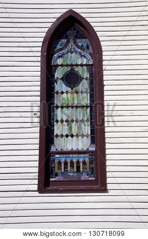 A stained glass window in  the former St Mary's Catholic Church, which was originally built in 1836 as a Universalist church, and now sits abandoned in downtown Plainfield, Illinois.