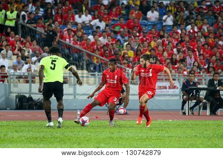 July 24, 2015- Shah Alam, Malaysia: Liverpool's Jordan Ibe (3) and Adam Lallana (20) plays in a friendly match against the Malaysian Team. Liverpool Football Club from England is on an Asia tour.