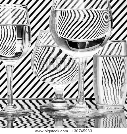Glass with water refraction and reflection black white