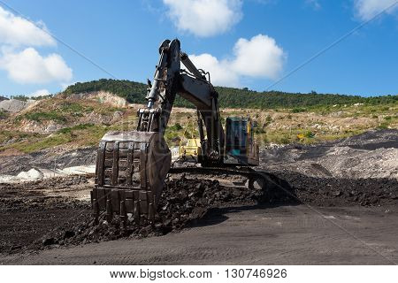 Yellow Backhoe Work In Coalmine