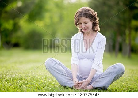 Happy Pregnant Woman Working Out In Park. Copy Space