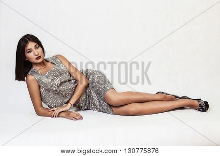 Beautiful woman with dark hair isolated on white background