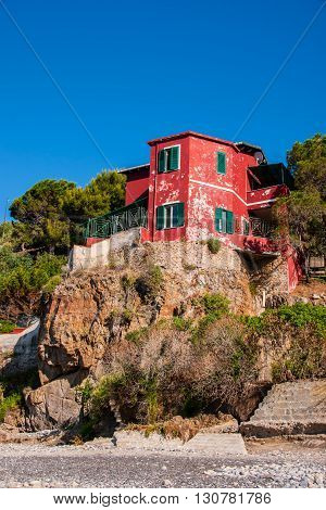 The old red building on the sea coast